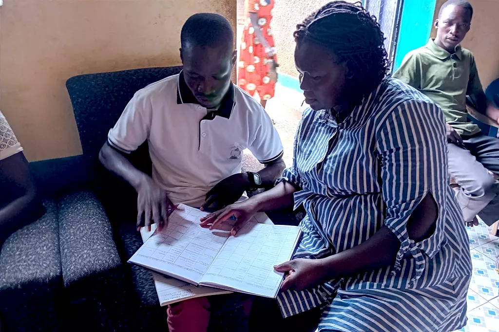 Wan Uganda staff looking records
